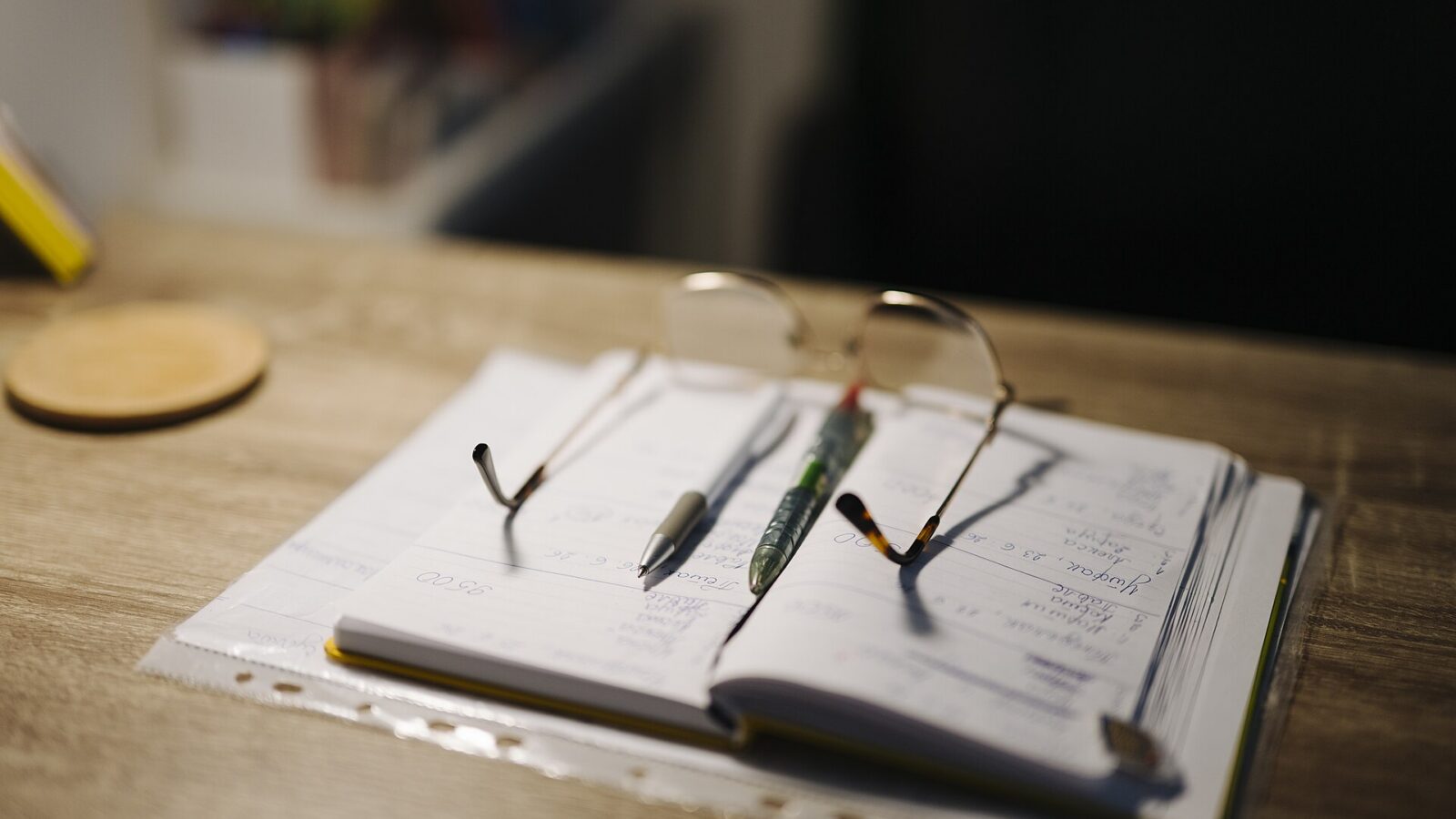 A notebook and pen on a desk